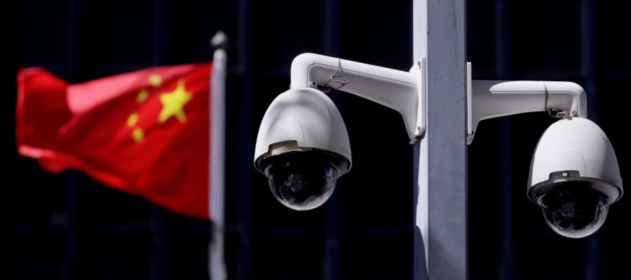 Security cameras in front of a Chinese flag