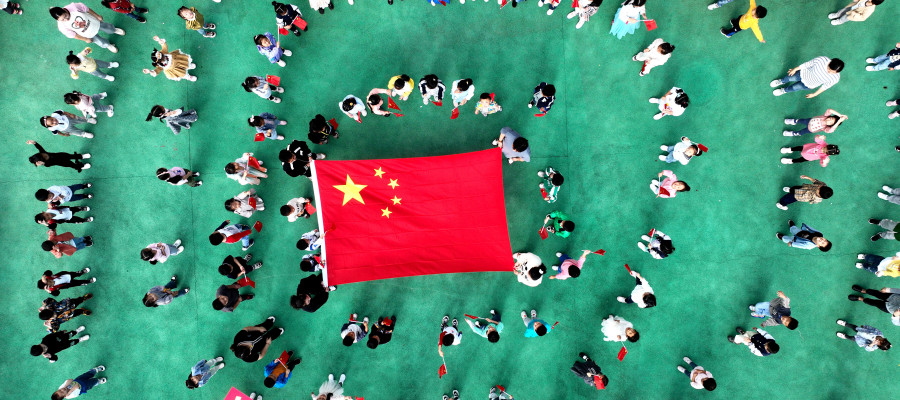 Kindergarten children pose with national flags in Lianyungang, Jiangsu province, China.