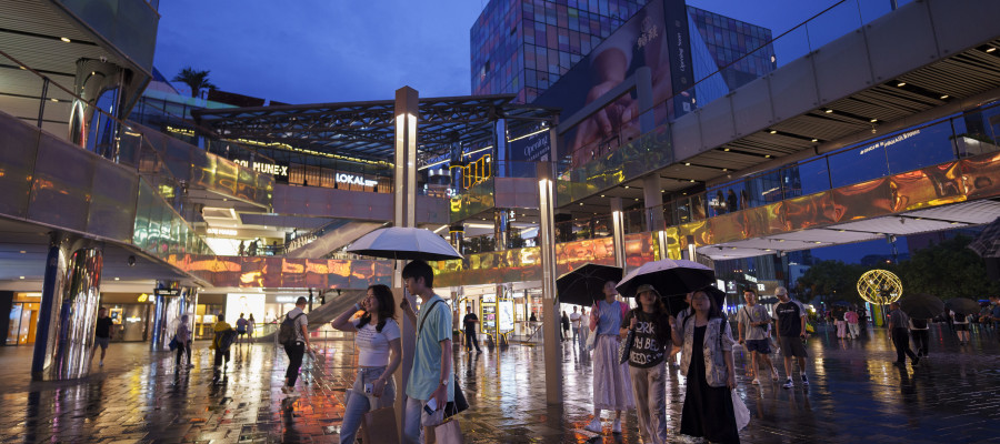 People shop at Taikoo Li Sanlitun in Beijing, China, Tuesday, July 2, 2024.