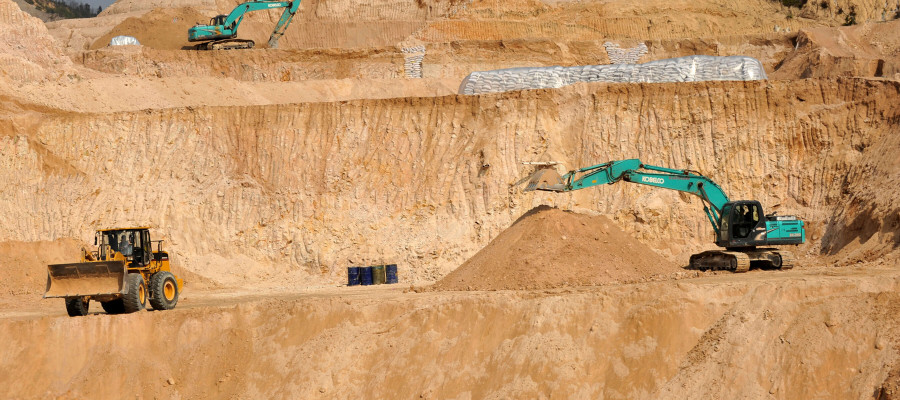 Workers use machinery to dig at a rare earth mine in Ganxian county in central China's Jiangxi province on Dec. 30, 2010.