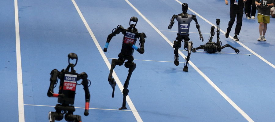 Unitree Robotics and Tiangong humanoid robots compete in the 100m final at the inaugural World Humanoid Robot Games, at the National Speed Skating Oval in Beijing, China August 17, 2025