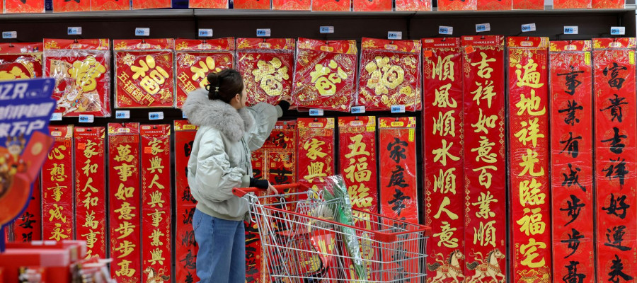 A Chinese consumer is shopping for spring couplets at a supermarket in Zaozhuang City, Shandong Province, China on January 9, 2026