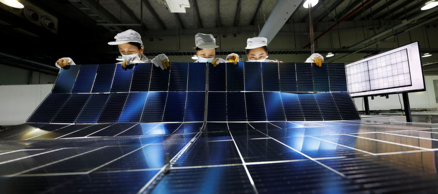 orkers are manufacturing photovoltaic module export products in the production workshop in Suqian City, Jiangsu Province, China on July 22, 2025.