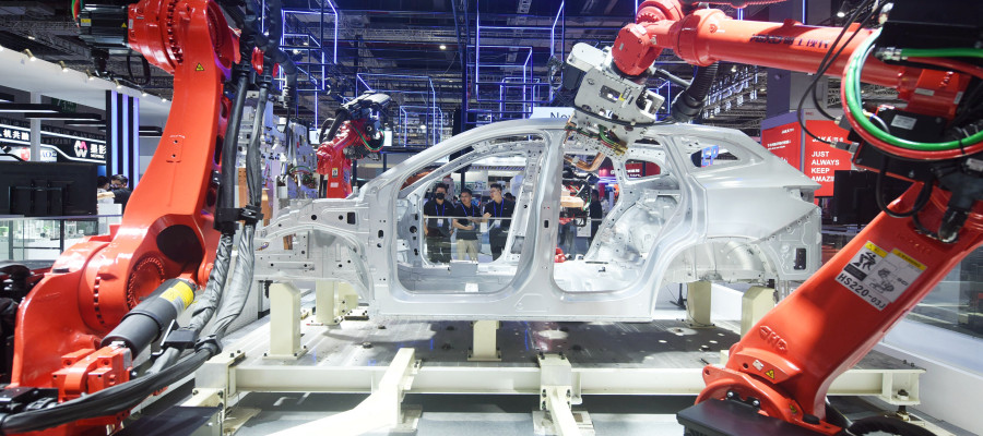 Robots make cars at the China International Industrial Expo in Shanghai