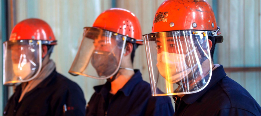 Chinese workers survey the production of steel at a plant of Qingdao Special Iron and Steel Co., Ltd. in Qingdao city.