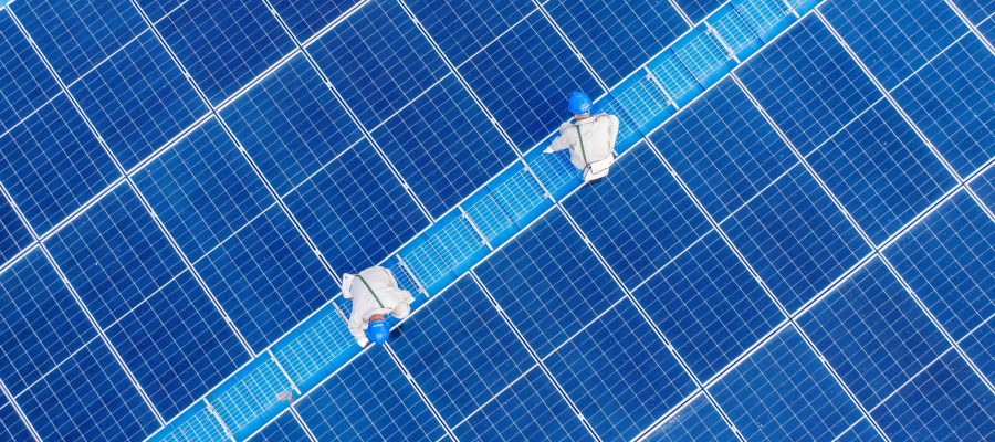 ower workers inspected the operation status of photovoltaic power generation equipment on the roof of a company in Yangzhou City, Jiangsu Province, China on June 24, 2025.