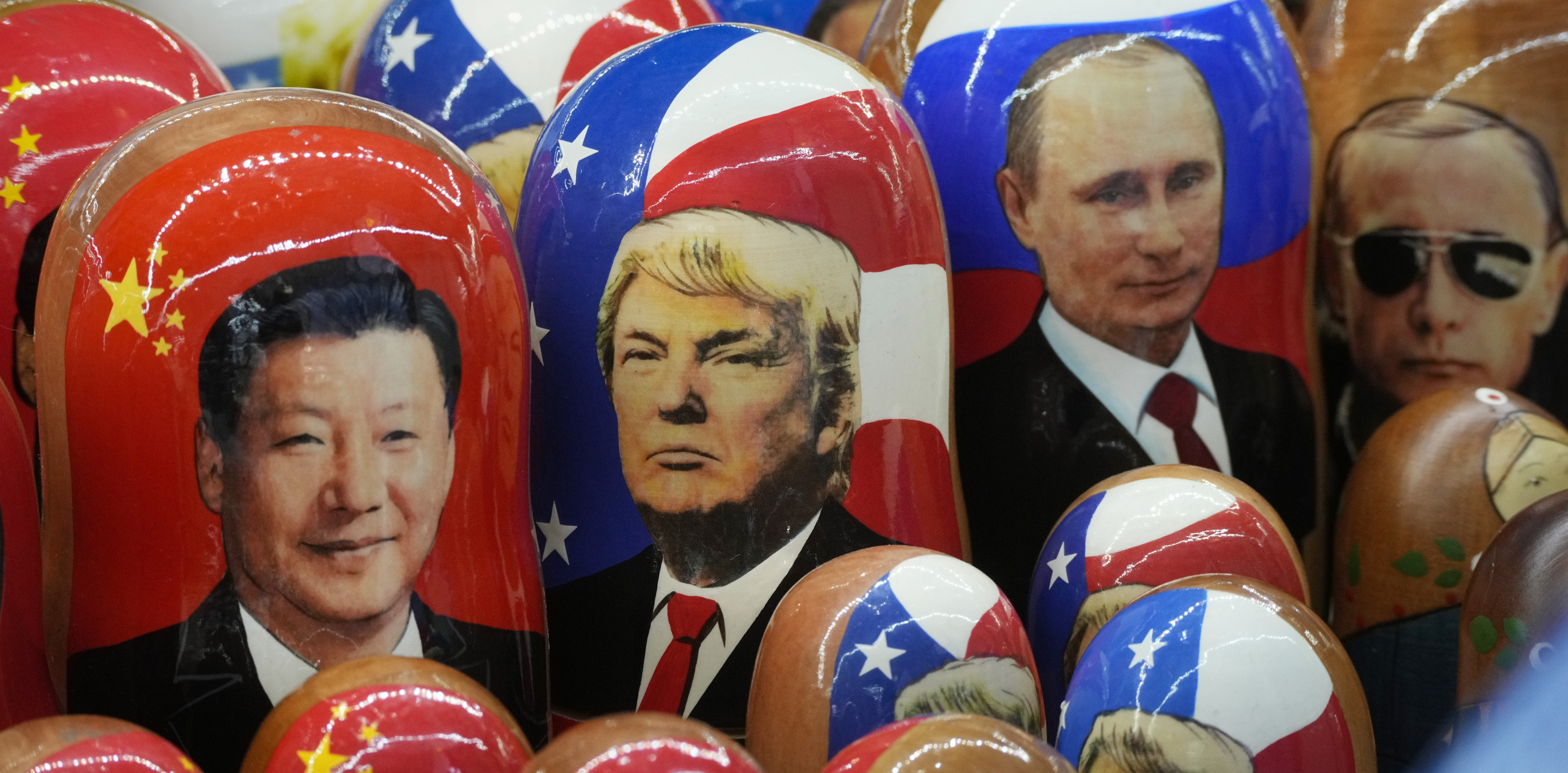 Traditional Russian wooden dolls called Matryoshka depicting China's President Xi Jinping, U.S. President-elect Donald Trump and Russian President Vladimir Putin are displayed for sale at a souvenir shop in St. Petersburg, Russia.