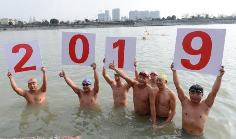 Chinese winter swimmers celebrate the new year's day of 2019 in the icy water of Chaohu lake in Anhui province. 