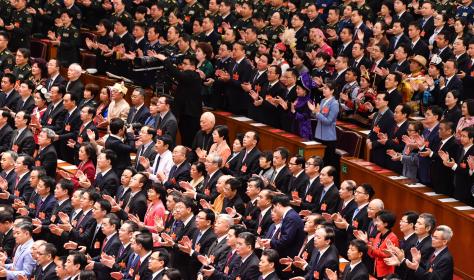 Deputies attend the closing meeting of the National People's Congress in Beijing on March 15, 2019. 