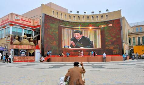 A speech by state and party leader Xi Jinping is televised in front of the Id Kah Mosque in Kashgar, Xinjiang.