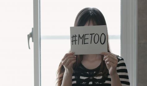 Asian girl holding a #MeToo sign
