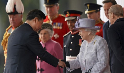 Chinese President Xi Jinping, left, shakes hands with Britain's Queen Elizabeth II in London Tuesday, Oct. 20, 2015, on the first day of their state visit to the United Kingdom. 