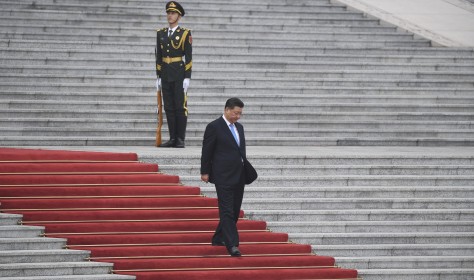 Xi Jinping walks down steps at the Great Hall of the People