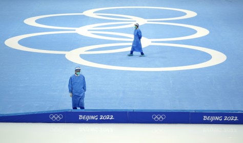 Medical personnel stand ready for activity during a scheduled speedskating practice session inside at the National Speed Skating Oval the 2022 Winter Olympics