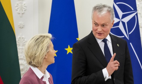 Lithuania's President Gitanas Nauseda, right, and European Commission President Ursula von der Leyen speak prior to their meeting at the Presidential palace in Vilnius, Lithuania, Sunday, Nov. 28, 2021