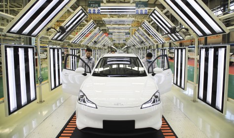 Employees work on the assembly line of Neta electric car at a factory of Hozon New Energy Automobile Co., Ltd on February 19, 2021 in Jiaxing, Zhejiang