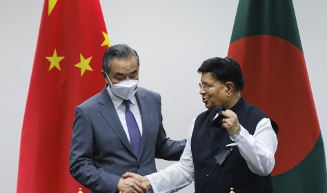 Chinese Foreign Minister Wang Yi, left, stands with his Bangladeshi counterpart A.K. Abdul Momen during their meeting in Dhaka,