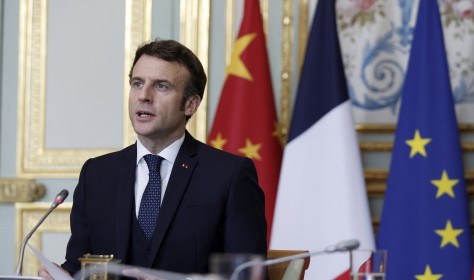 French President Emmanuel Macron attends a video-conference with German Chancellor Olaf Scholz and Chinese President Xi Jinping to discuss the Ukraine crisis at the Elysee Palace in Paris, Tuesday, March 8, 2022.