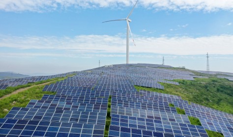 A wind-complementary power station is seen on a barren hill in Xuzhuang town, Shanting district of Zaozhuang, Shandong Province, China, Aug 26, 2022.