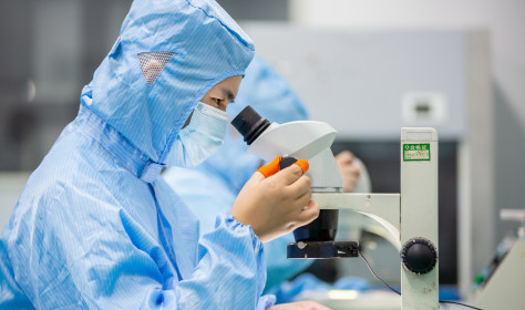 A worker prepares an order for export light filters at a workshop in Nantong, Jiangsu province, China.