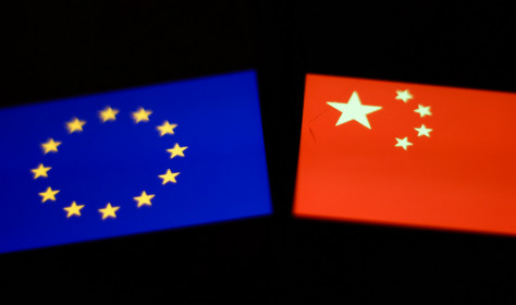 Flags of European Union and China displayed on screens