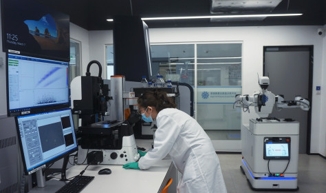 A researcher watches the results of protein analysis on a fully automated single-cell proteome analysis platform at the Hangzhou International Science and Innovation Center Laboratory of Zhejiang University in Hangzhou, Zhejiang province, China, March 7, 2024.