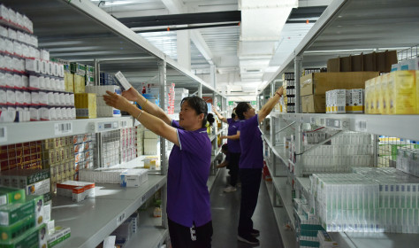 Employees sort out drugs at a pharmaceutical logistics company in Zhangjiakou, Hebei province, China