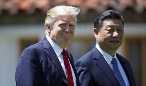 In this April 7, 2017, file photo President Donald Trump and Chinese President Xi Jinping walk together after their meetings at Mar-a-Lago.