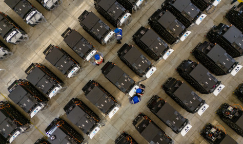 Workers debug smart mobile charging piles at Nantong Guoxuan New Energy Technology Co., LTD., located in Nantong High-tech Zone, East China's Jiangsu provincr