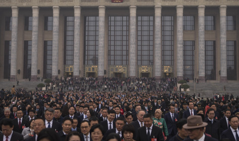Delegates leave the Great Hall of the People after attending the closing ceremony of the National People's Congress in Beijing, Tuesday, March 11, 2025. 