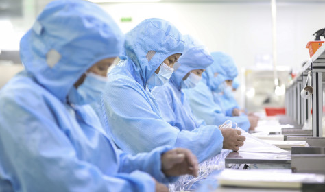 Workers make medical infusion sets for export at a workshop in Huai 'an City, Jiangsu Province, China