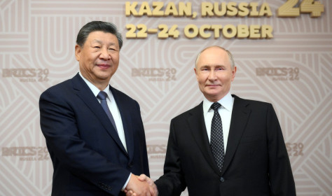 Russian President Vladimir Putin, right, welcomes Chinese President Xi Jinping, for the 16th BRICS summit at the Kazan Kremlin