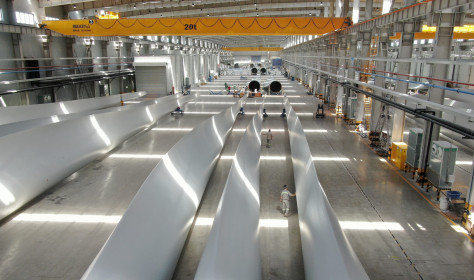 Employees inspect wind turbine blades at a workshop of Shanghai Aeolon Wind Energy Technologies Development (Group) Co Ltd. on May 13, 2020 in Nantong, Jiangsu Province of China.