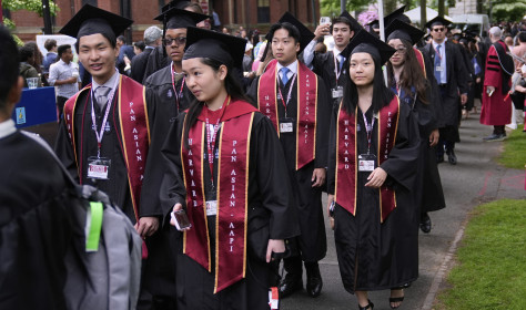 Students proceed through Harvard Yard during commencement ceremonies at Harvard University, Thursday, May 29, 2025, in Cambridge, Mass. 