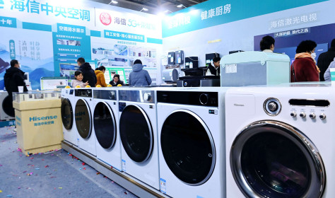 Chinese citizens look at home appliances. The Chinese government introduced trade-in programs on costlier household purchases like washing machines and fridges to lift consumption in Q2 2025.