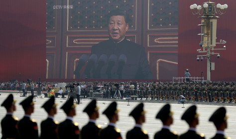 A huge screen shows Chinese President Xi Jinping delivering a speech at the start of a parade to mark the 70th anniversary of the founding of the People's Republic of China, in Beijing, Tuesday, Oct. 1, 2019. (AP Photo/Mark Schiefelbein)