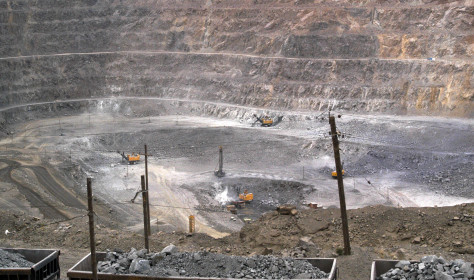 In this photo taken Tuesday, July 6, 2010, workers use machinery to dig at a rare earth mine in Baiyunebo mining district 