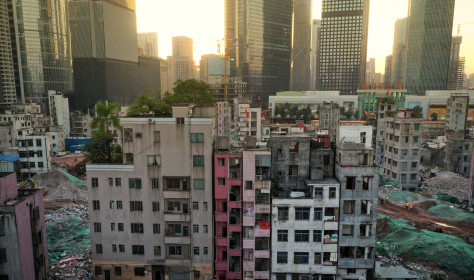 A sharp contrast between Xian village and skyscrapers around in Guangzhou city, south China's Guangdong province.