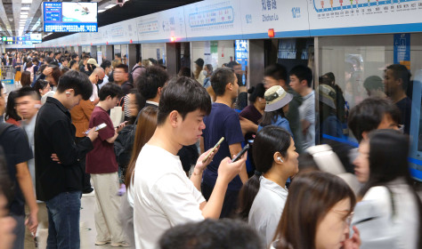 People travel by subway at Zhichun Road Subway Station in Beijing, China on September 17, 2025.