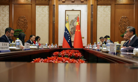 Chinese Foreign Minister Wang Yi, right, and Venezuelan Foreign Minister Yvan Gil Pinto, left, attend a meeting at the Diaoyutai State Guesthouse in Beijing, Monday, May 12, 2025.