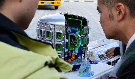 People view a model of the Burning Plasma Experimental Superconducting Tokamak (BEST)