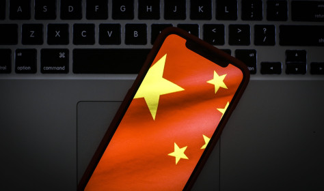 The Chinese flag is seen on a portable mobile device in this photo illustration 
