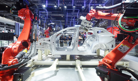 Robots make cars at the China International Industrial Expo in Shanghai