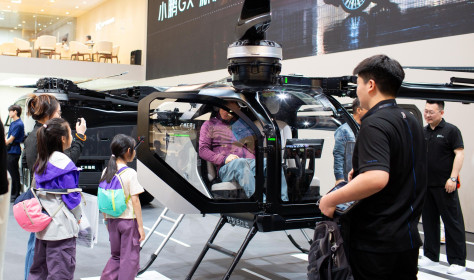 Visitors check out the cockpit section of Xpeng Aeroht's modular flying car 'Land Aircraft Carrier' at the 2026 Beijing Auto Show in Beijing, 28 April, 2026.