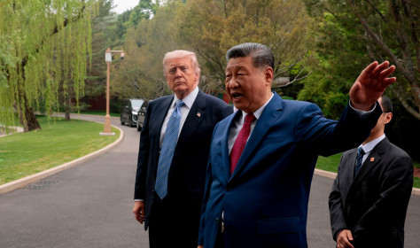 Chinese President Xi Jinping, center, gestures as he greets U.S. President Donald Trump at Zhongnanhai Garden in Beijing, Friday, May 15, 2026.