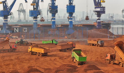 Trucks dump bauxite imported from Guinea into a pile at a ore dock in Yantai in eastern China's Shandong province, Wednesday, March 25, 2026. Bauxite smelters produce rare-earth elements (REEs) as a byâproduct, Credit:TANG KE / Avalon