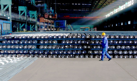 A technician inspects the quality of steel products to be delivered, Zhangjiakou City, Hebei Province, China