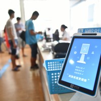 A self-service machine supported by face recognition technology of Alipay, to pay fees at a hospital in Dongyang, Zhejiang province. 
