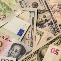 Various currency banknotes including the US-Dollar, Euro and Chinese yuan