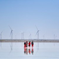 People in front of wind turbine